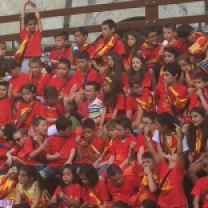 Children from each contrada in the race singing their respective fight songs