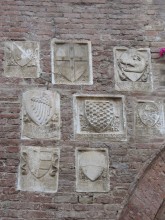 Family Crests on Wall of Buonconvento